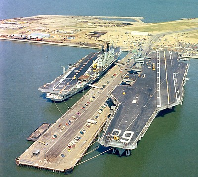 The older and larger HMS Ark Royal docked alongside USS Nimitz in 1978