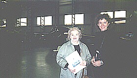 Mrs Isobel Hall presents her late husband's book to Dawn Kemp